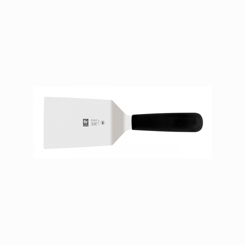 White spatula with black handle on a white background